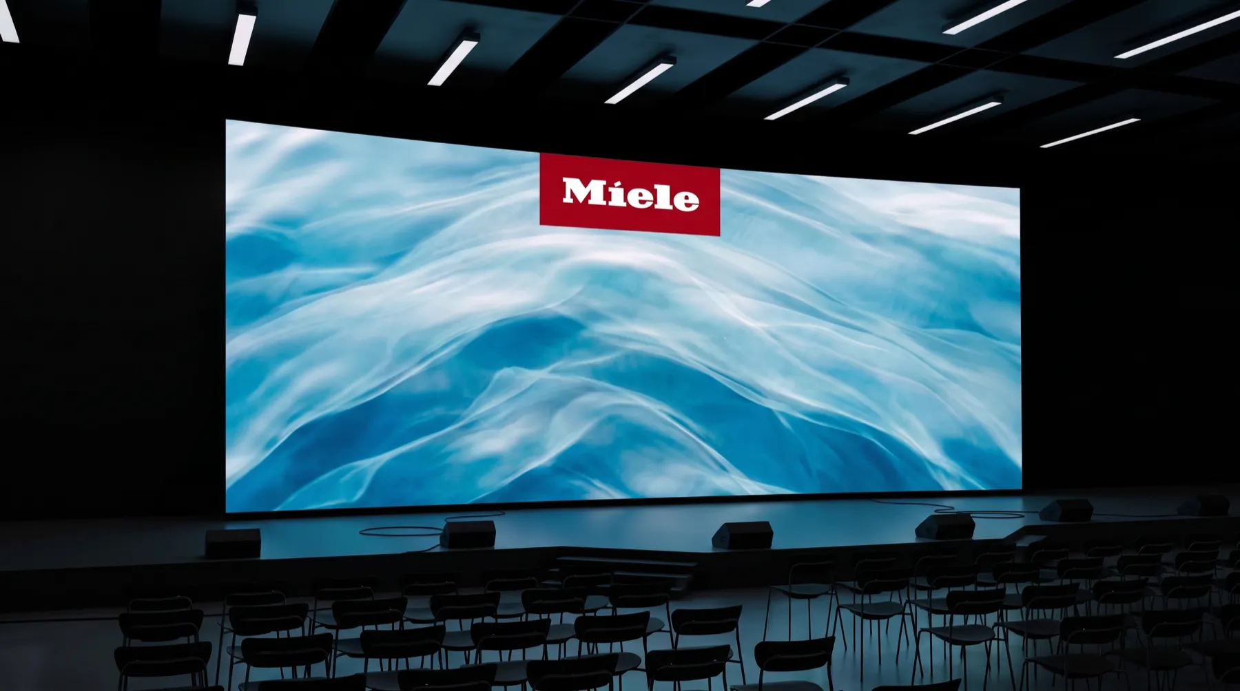 Miele — AI vizuály na konferenční obrazovce